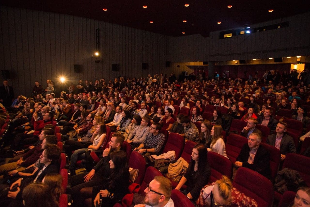 a packed cinema hall at the conference